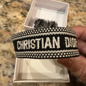 NIB. Christian Dior black/white friendship bracelet. Adjustable w tassels
